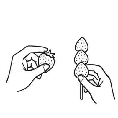 いちごを選び串に刺す作業